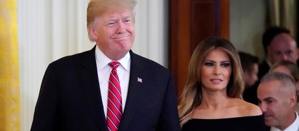 ميلانيا ترامب مع زوجها الرئيس الأمريكي دونالد ترامب - سبوتنيك عربي