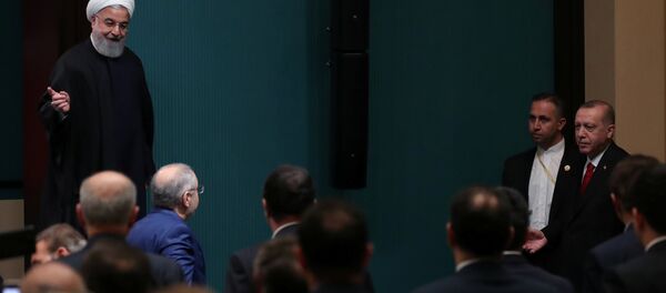 الرئيس الإيراني حسن روحاني في مؤتمر صحفي مشترك مع نظيره التركي في أنقرة - سبوتنيك عربي