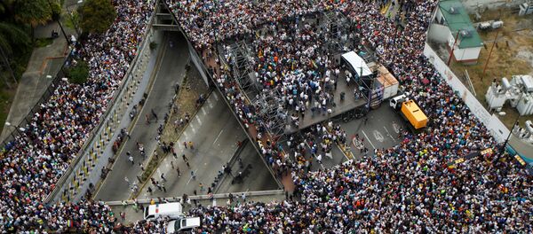 مظاهرات في كاراكاس، فنزويلا 23 يناير/ كانون الثاني 2019 - سبوتنيك عربي