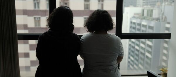 الشقيقتان السعوديتان اللتان اتخذتا أسماء مستعارة ريم وروان في مكتب محاميهم مايكل فيدلر في هونغ كونغ - سبوتنيك عربي