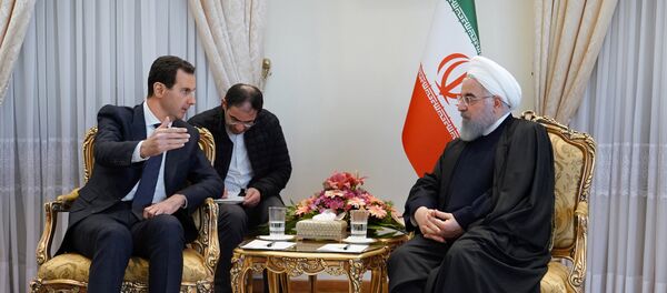 الرئيس الإيراني يستقبل الرئيس السوري بشار الأسد في طهران  - سبوتنيك عربي