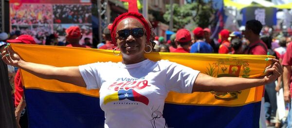 مشاركة في مسيرة داعمة للرئيس الفنزويلي نيكولاس مادورو في كاراكاس، فنزويلا مشاركة في مسيرة داعمة للرئيس الفنزويلي نيكولاس مادورو في كاراكاس، فنزويلا - سبوتنيك عربي