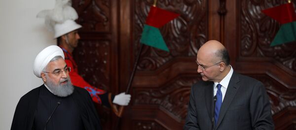 الرئيس العراقي برهم صالح في مؤتمر صحفي مع نظيره الإيراني حسن روحاني - سبوتنيك عربي