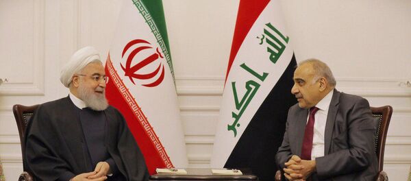 رئيس الوزراء العراقي عادل عبد المهدي مع الرئيس الإيراني حسن روحاني في بغداد في 11 مارس / أذار 2019 - سبوتنيك عربي