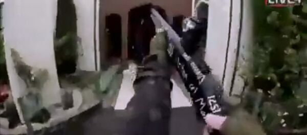 A still image taken from video circulated on social media, apparently taken by a gunman and posted online live as the attack unfolded, shows him entering a mosque in Christchurch, New Zealand, March 15, 2019 - سبوتنيك عربي