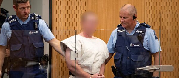 برينتون تارانت المتهم بارتكاب جريمة قتل بهجمات مسجد نيوزيلندا في الطريق إلى قفص الاتهام لمثوله أمام محكمة مقاطعة كرايستشيرش برينتون تارانت المتهم بارتكاب جريمة قتل بهجمات مسجد نيوزيلندا في الطريق إلى قفص الاتهام لمثوله أمام محكمة مقاطعة كرايستشيرش - سبوتنيك عربي