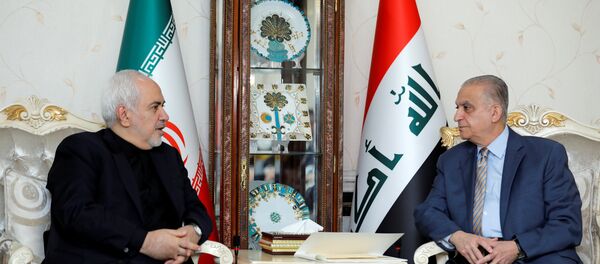 وزير الخارجية الإيراني محمد جواد ظريف خلال مؤتمر صحفي مع وزير الخارجية العراقي محمد علي الحكيم في بغداد - سبوتنيك عربي