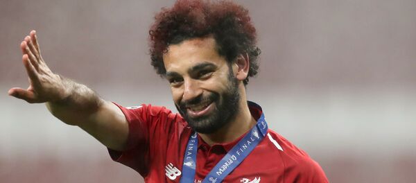 محمد صلاح يحتفل بالفوز بدوري أبطال أوروبا - سبوتنيك عربي