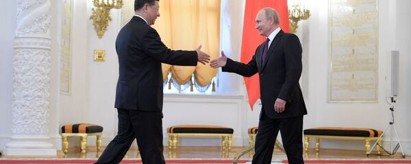 لقاء الرئيس فلاديمير بوتين مع نظيره الصيني شي جين بينغ في الكرملين، موسكو 5 يونيو/ حزيران 2019 - سبوتنيك عربي