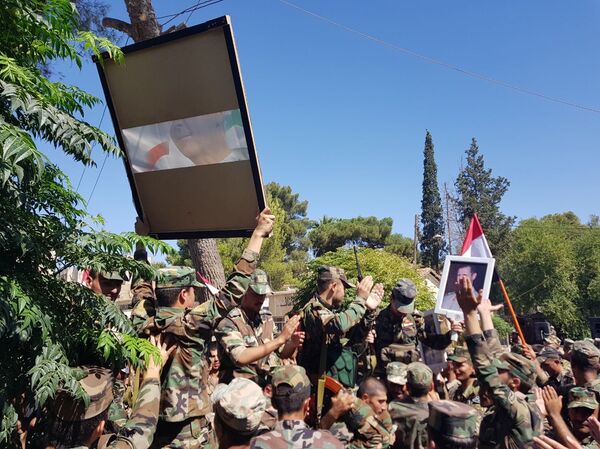 بالصور... جنود سوريون يحتفلون بعيد الجيش وسط غابة من القواعد الأمريكية بالصور... جنود سوريون يحتفلون بعيد الجيش وسط غابة من القواعد الأمريكية - سبوتنيك عربي