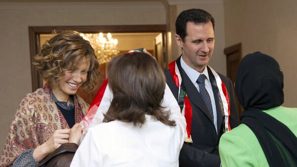 الرئيس السوري بشار الأسد وزوجته أسماء الأسد - سبوتنيك عربي