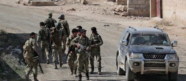 مقاتلون تابعون للجيش التركي في مدينة تل أبيض مقاتلون تابعون للجيش التركي في مدينة تل أبيض - سبوتنيك عربي