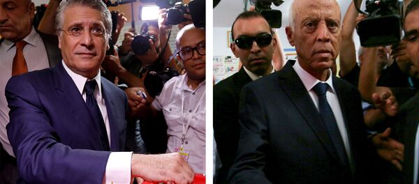 المترشحان قيس سعيد ونبيل القروي يدليان بصوتيهما في الدور الثاني للانتخابات الرئاسية التونسية - سبوتنيك عربي