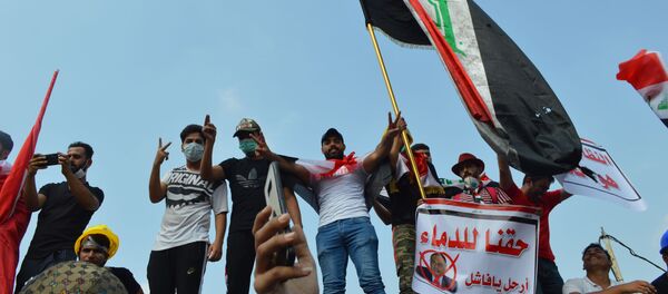 المتظاهرون في ساحة التحرير، بغداد - سبوتنيك عربي