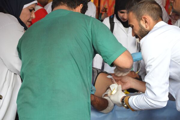 مصارعة الموت لإنقاذ المتظاهرين العراقيين من الرصاص والقنابل (صور وفيديو) - سبوتنيك عربي