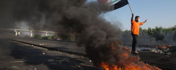 متظاهر عراقي في مدينة البصرة متظاهر عراقي في مدينة البصرة - سبوتنيك عربي
