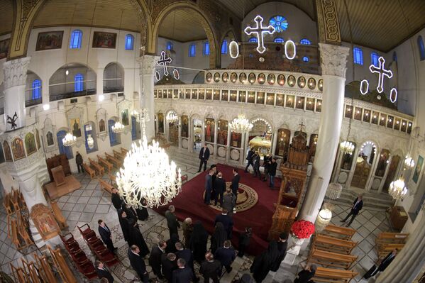 الرئيس فلاديمير بوتين والرئيس بشار الأسد يزوران الكنيسة المريمية‎ في دمشق، 7 يناير 2020 - سبوتنيك عربي