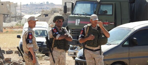 جنود روس في معبر أبو الضهور الإنساني - سبوتنيك عربي