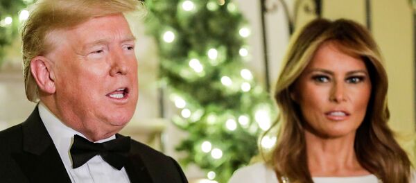 ميلانيا ترامب وزوجها الرئيس الأمريكي دونالد ترامب - سبوتنيك عربي