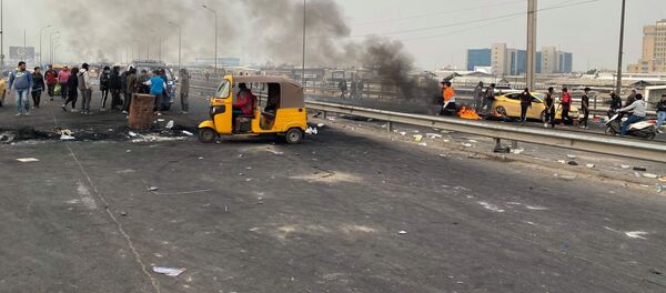 حصيلة قتلى وجرحى بين المحتجين في سريع بغداد محمد القاسم إثر الرصاص  - سبوتنيك عربي
