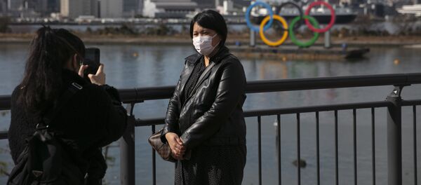 سياح صينيون يرتدون أقنعة واقية طوكيو، اليابان، 29 يناير 2020 - سبوتنيك عربي