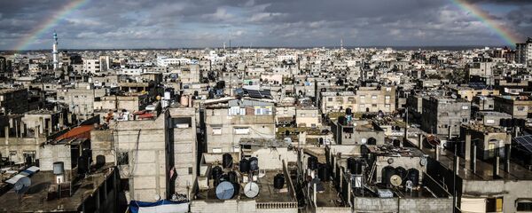قوس قزح كبير يعلو مدينة رفح، قطاع غزة، فلسطين 10 فبراير 2020 - سبوتنيك عربي