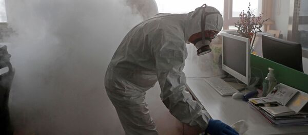 تطهير مكاتب العمل في شنغهاي، بعد الإعلان عن انتشار فيروس كورونا في الصين 12 فبراير 2020 - سبوتنيك عربي