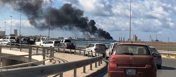 دخان يتصاعد من ميناء طرابلس بعد تعرضه لقصف مدفعي دخان يتصاعد من ميناء طرابلس بعد تعرضه لقصف مدفعي - سبوتنيك عربي