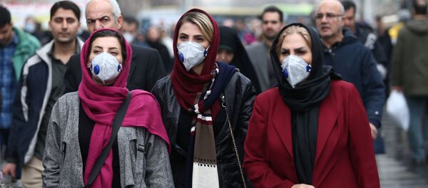 نساء إيرانيات يرتدين أقنعة بعد تفشي فيروس كورونا في إيران - سبوتنيك عربي