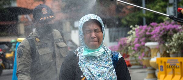 عمليات التعقيم والتطهير في إندونيسيا، كورونا 23 مارس 2020 - سبوتنيك عربي