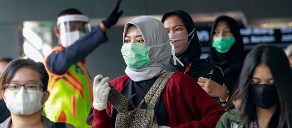 ارتداء الكمامات في إندونيسيا - سبوتنيك عربي