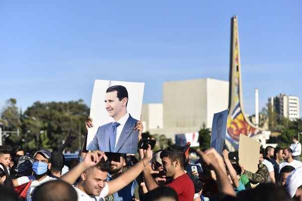 تجمع جماهيري في العاصمة السورية تنديدا بـقانون قيصر ورفضا للحصار الغربي... صور - سبوتنيك عربي