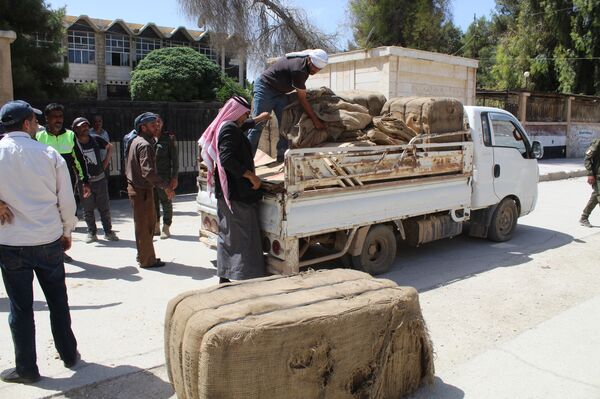خبز السوريين في خطر... مسلحون موالون للجيش الأمريكي ينفذون حصتهم من قيصر  - سبوتنيك عربي
