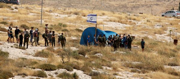 مستوطنات الضفة الغربية المحتلة، قرية السوسية، اشتباكات بين الفلسطينيين وشرطة الحدود الإسرائيلية بالقرب من الخليل، 19 يونيو 2020 - سبوتنيك عربي